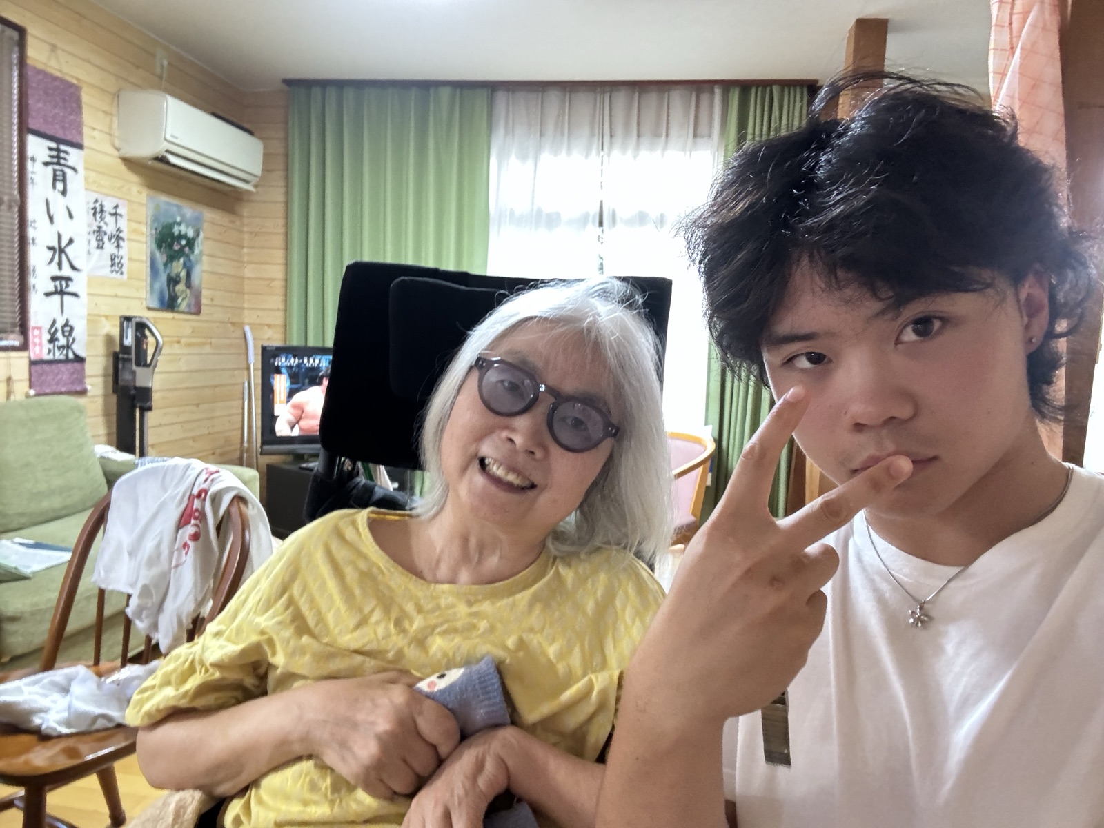 Xavier Nishikawa with his grandmother in her living room.